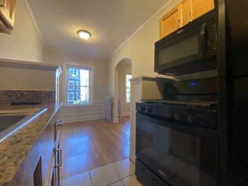 Upgraded kitchen with rich wood cabinetry